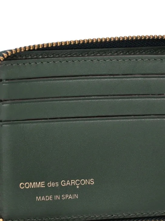 Comme des Garçons Wallet   Leather zip wallet 