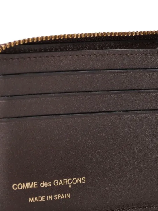 Comme des Garçons Wallet   Leather zip wallet 