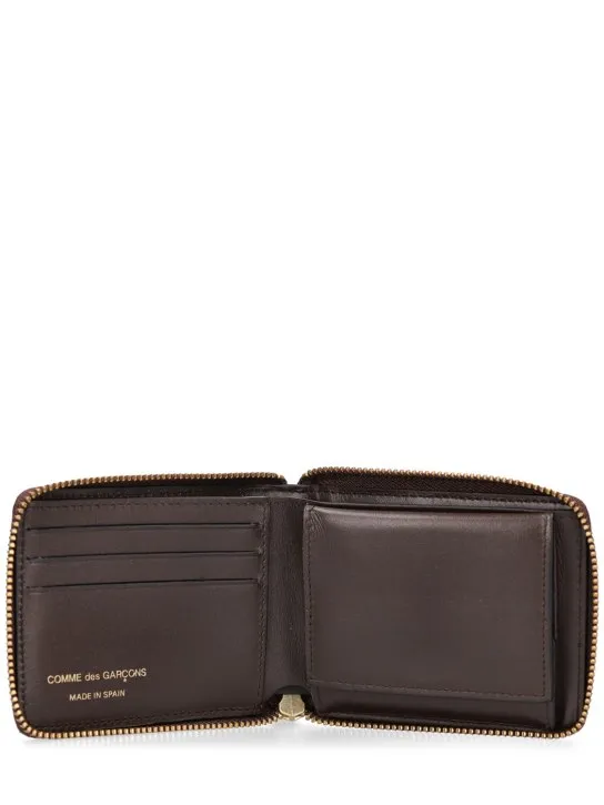 Comme des Garçons Wallet   Leather zip wallet 