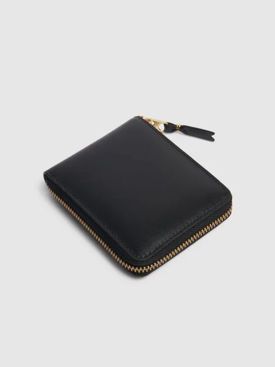 Comme des Garçons Wallet   Leather zip wallet 