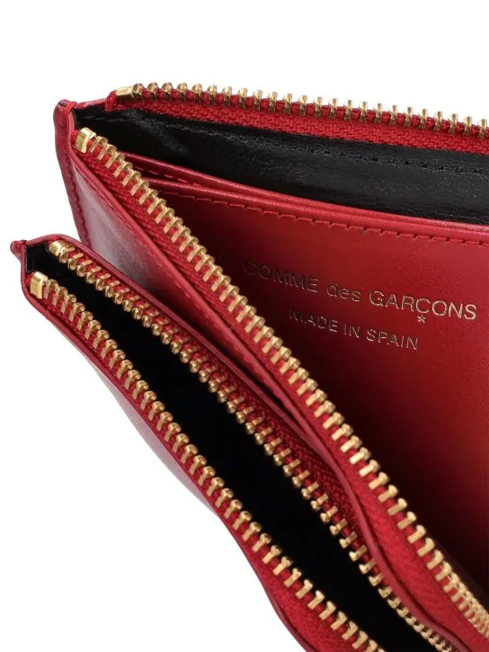 Comme des Garçons Wallet   Outside pocket zip wallet 