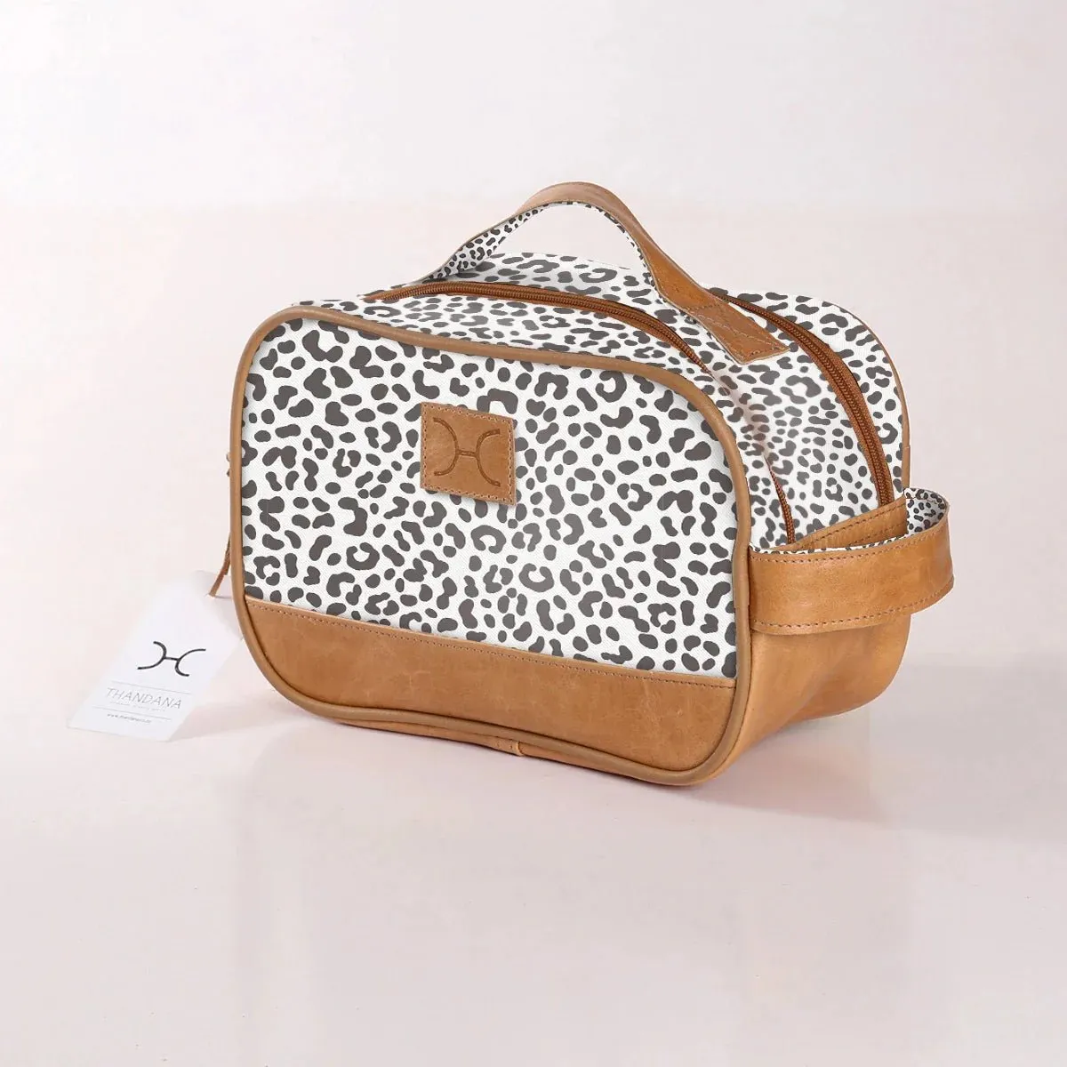 Thandana Laminated Fabric Vanity Bag | Cheetah White