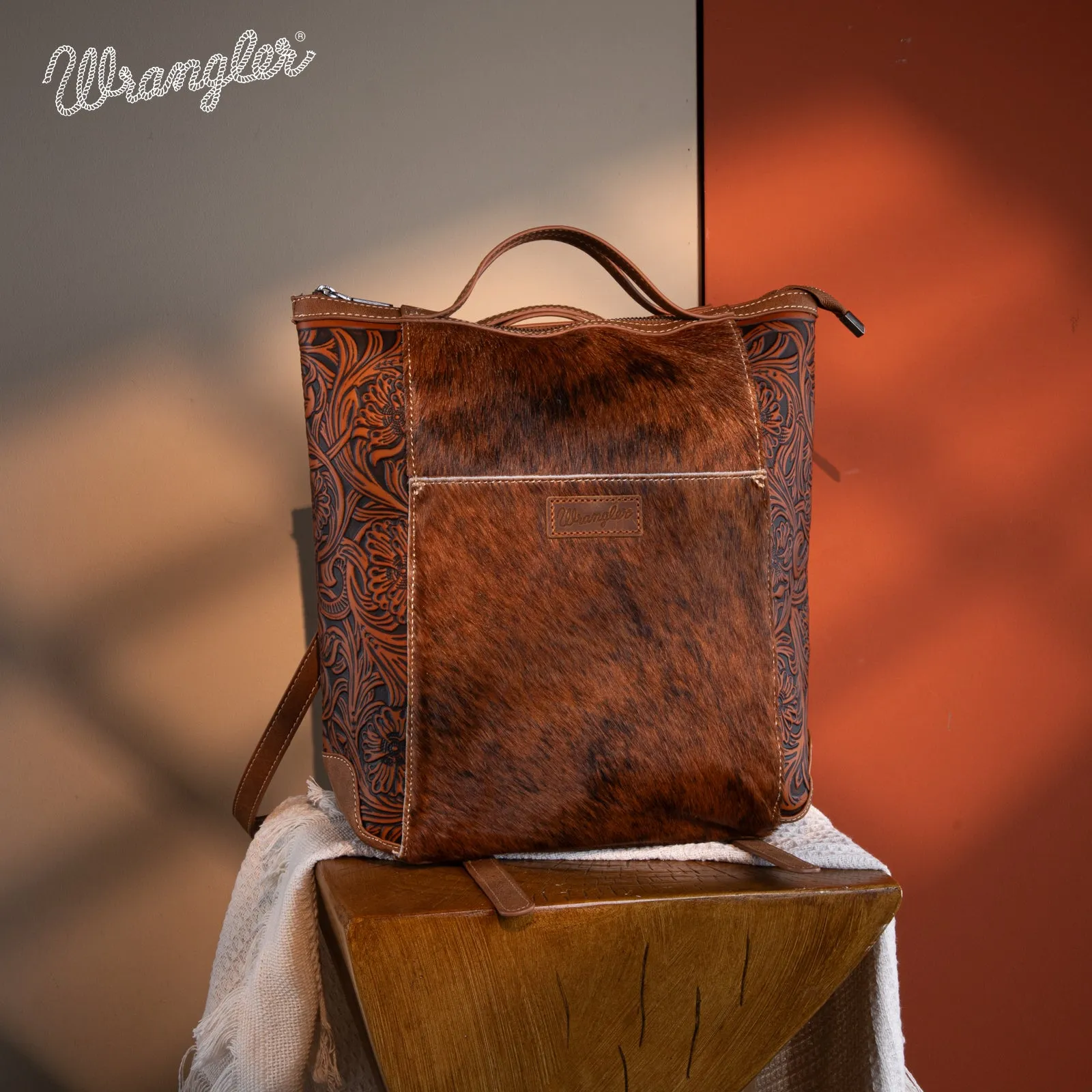 WG169-9112 Wrangler Genuine Hair-On Cowhide Floral Tooled Convertible Backpack/Crossbody - Brown)