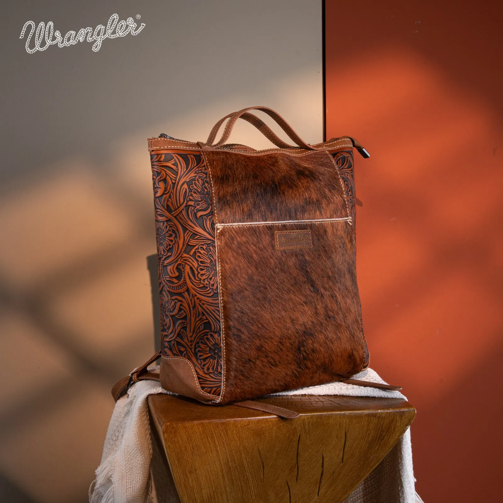 WG169-9112 Wrangler Genuine Hair-On Cowhide Floral Tooled Convertible Backpack/Crossbody - Brown)