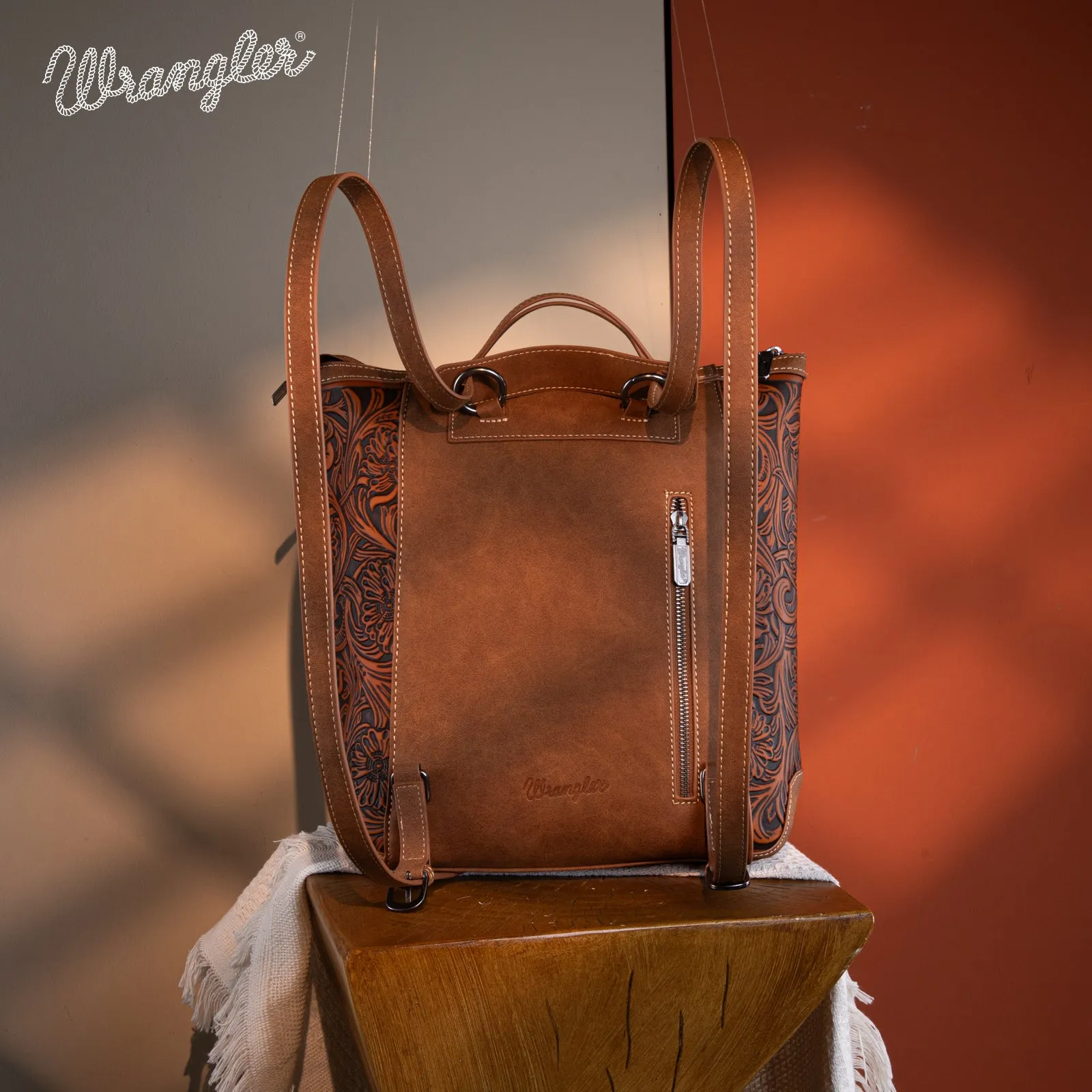 WG169-9112 Wrangler Genuine Hair-On Cowhide Floral Tooled Convertible Backpack/Crossbody - Brown)